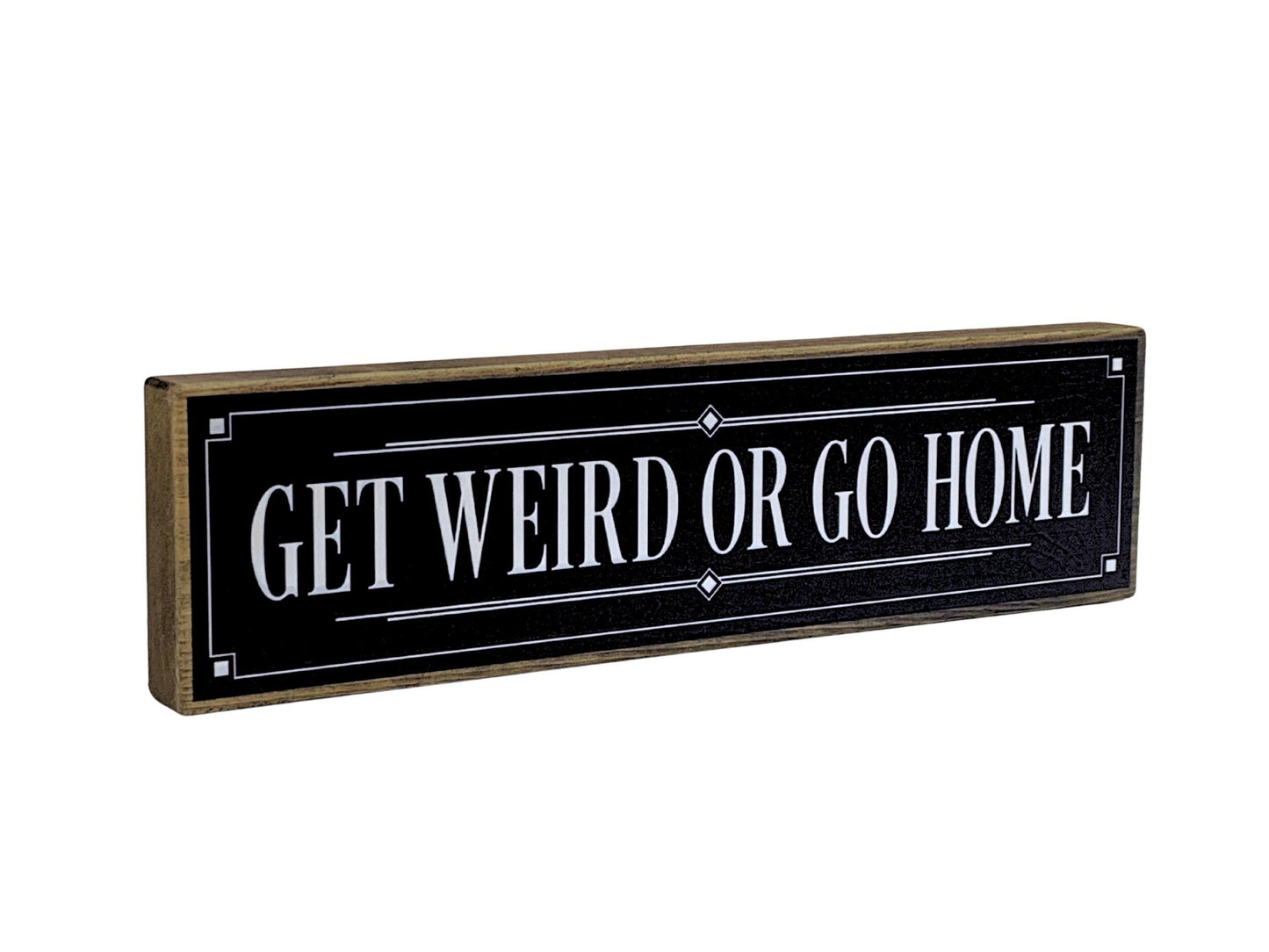 Decorative sign with 'GET WEIRD OR GO HOME' text on a black background
