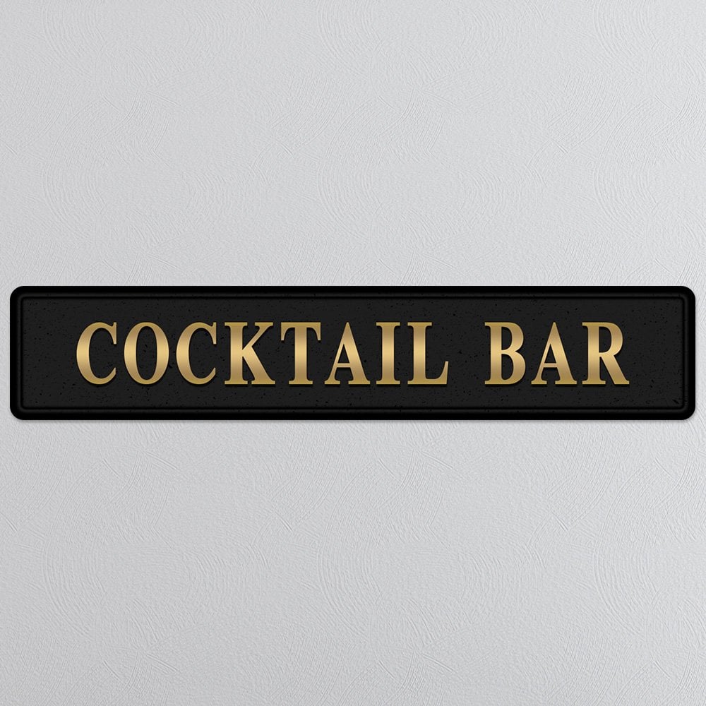 Black and gold foiled street sign with 'Cocktail bar' wording