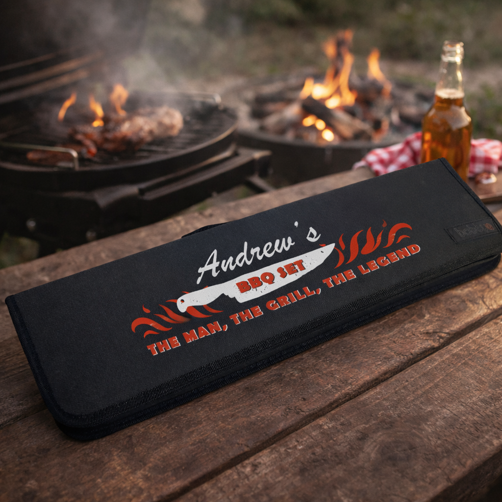 black bbq kit with personalised print next to a grill