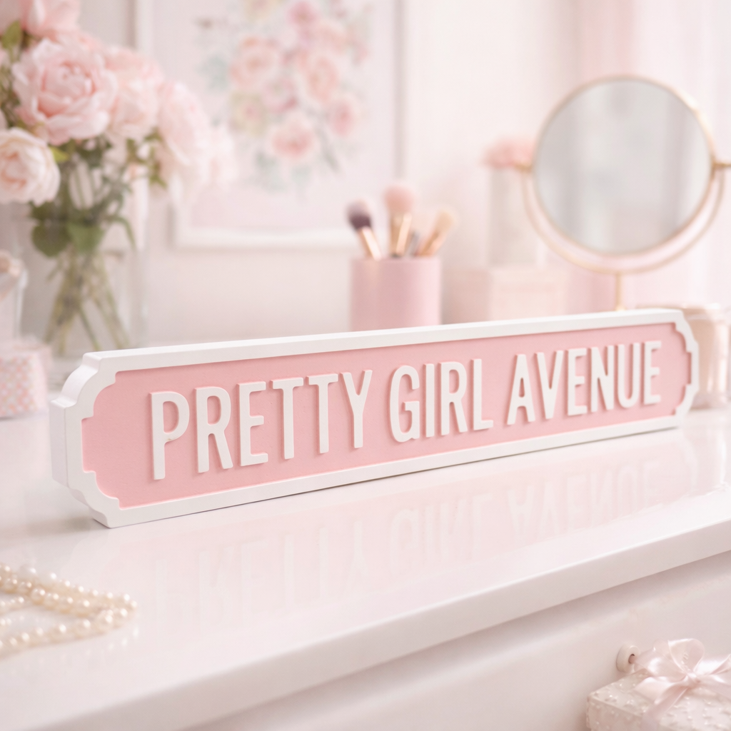 PINK AND WHITE PRETTY GIRL AVENUE WOODEN SIGN ON A FEMININE DRESSING TABLE