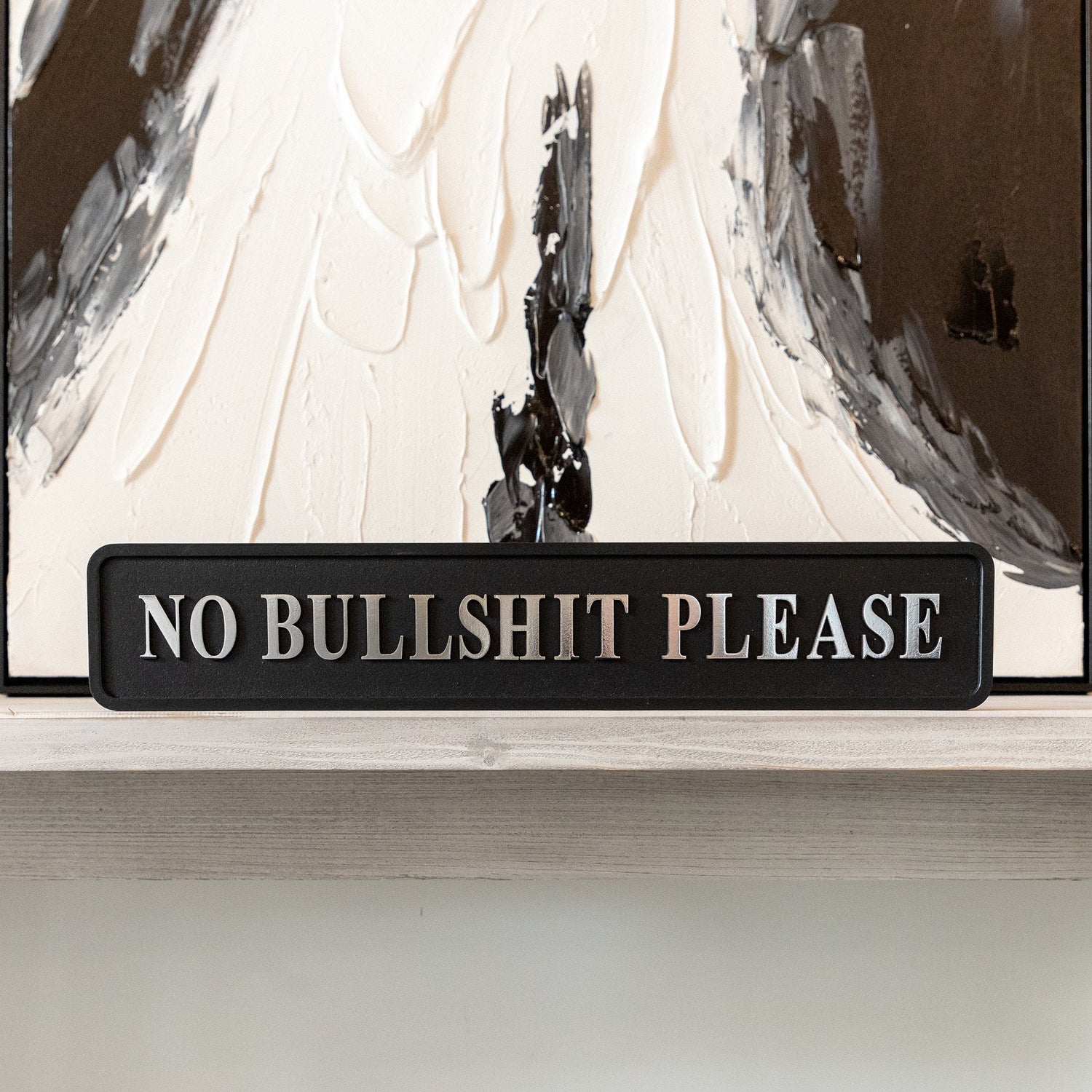 black and signed no bullshit please signature foiled street sign