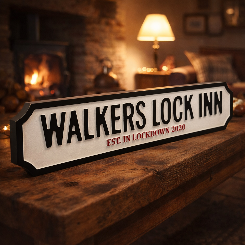 WOODEN STREET SIGN WITH PERSONALISED WORDS FREESTANDING ON A COFFE TABLE IN A COSY ROOM