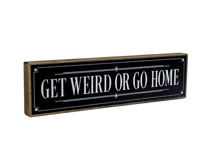 Decorative sign with 'GET WEIRD OR GO HOME' text on a black background