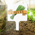 Garden marker with 'Chives' text and chive illustration in a garden setting