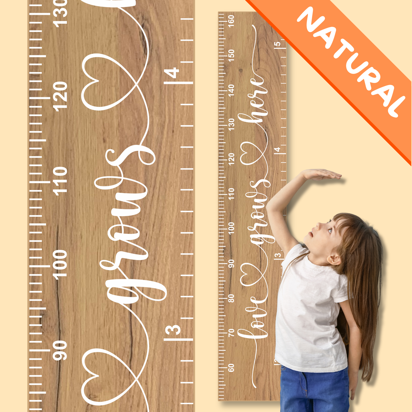 Wooden growth chart with the words 'love grows here' in cursive script printed up the center in white, with a child measuring their height against it