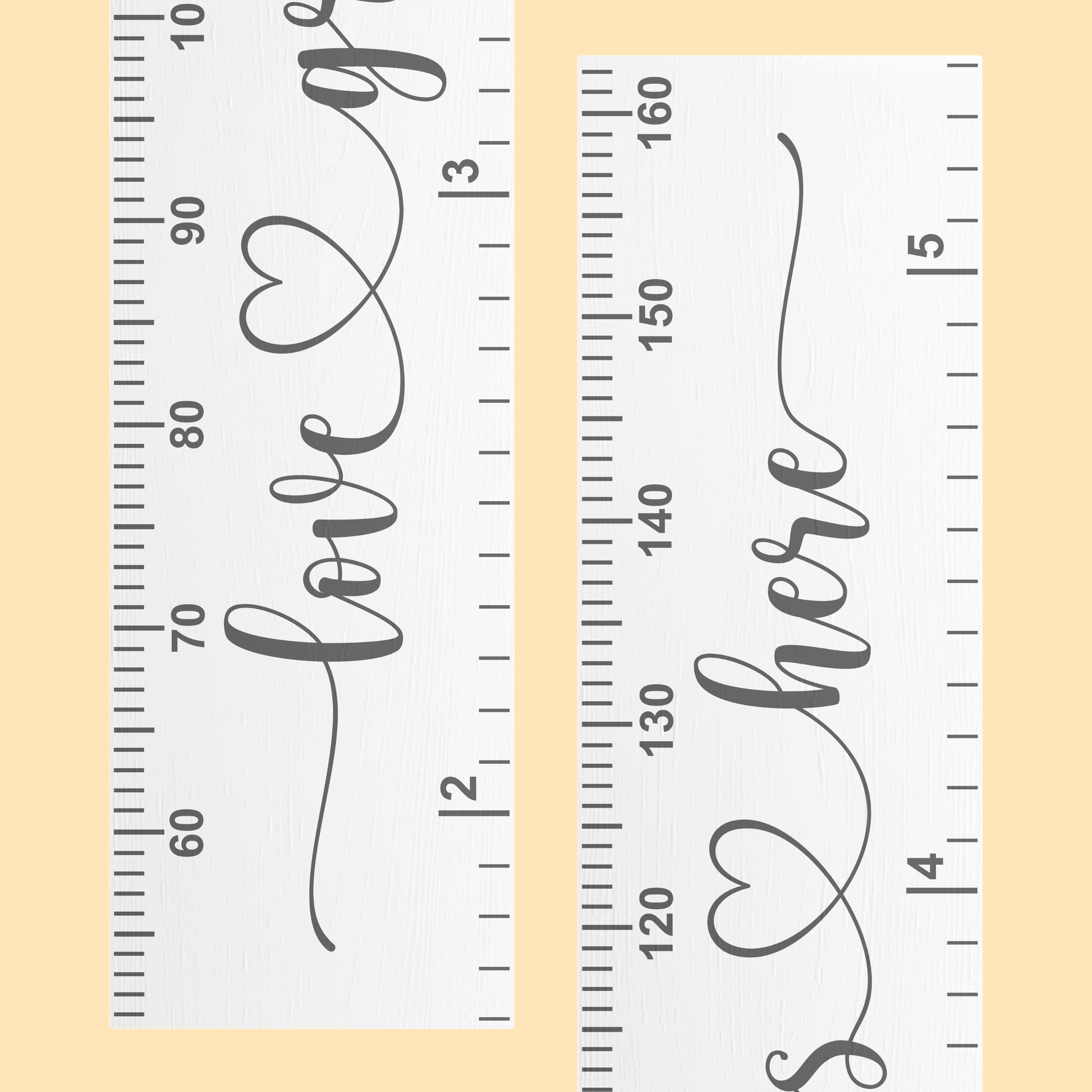 Close up of a white growth chart with the words 'love grows here' in cursive script printed up the center in grey