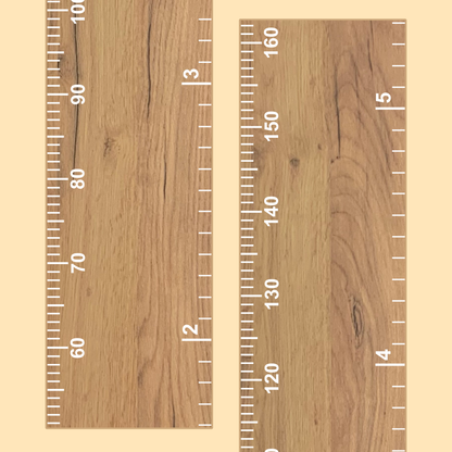 Wooden growth chart with white measurement scale on a wooden background