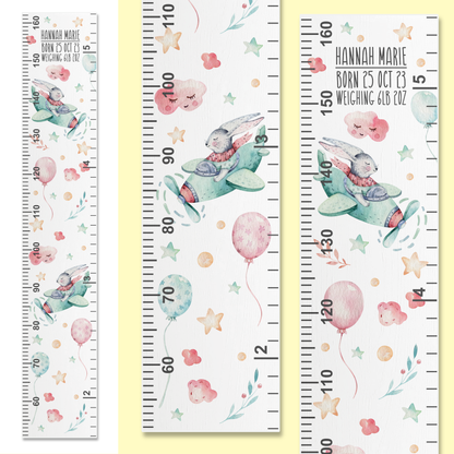 Three growth charts with watercolour bunny's flying a plane in the cloud. On on a white background