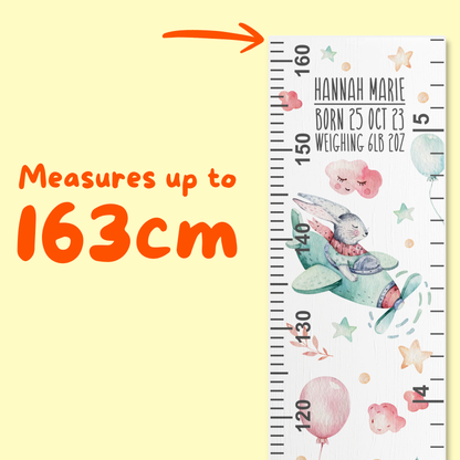 Children's height chart with watercolour bunnies flying planes and text on a yellow background