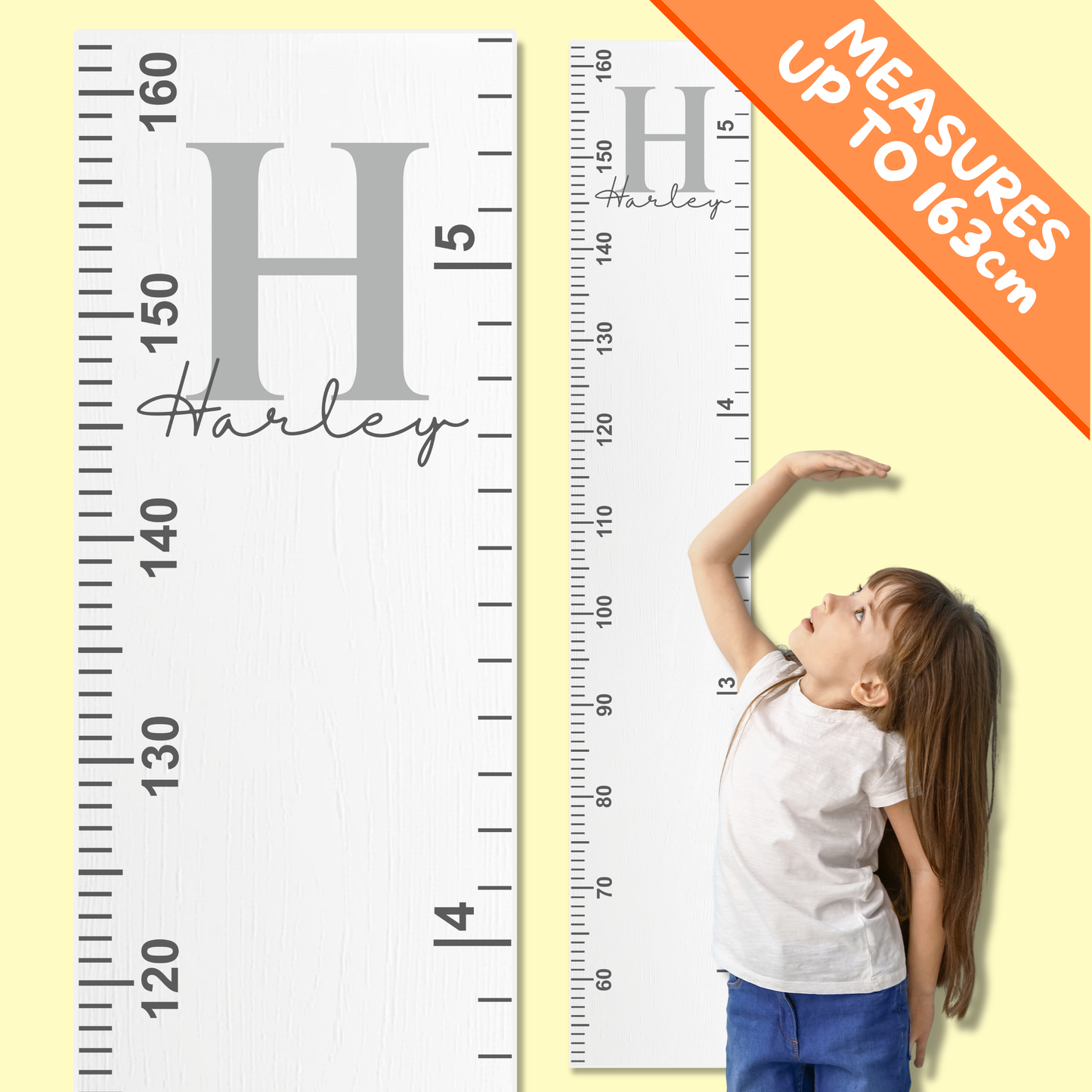 Child using a height measurement chart with personalised name and monogram inital on a yellow background