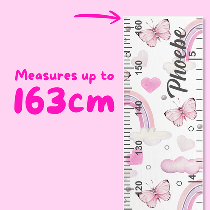 Children's height ruler with decorative elements on a pink background, indicating measurement up to 163cm.