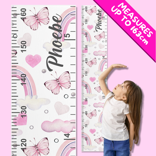 Personalized growth chart with pink butterflies, hearts, and rainbows, featuring a child measuring themselves.