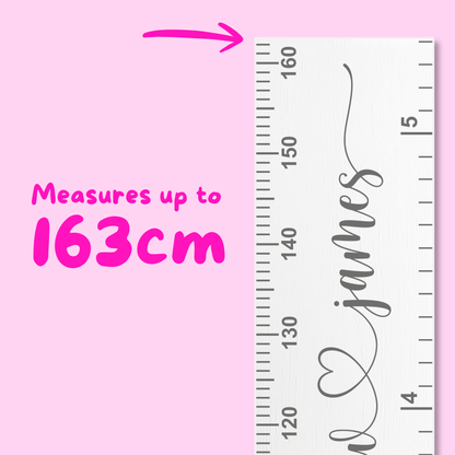Ruler with personalised names in cursive script font on a pink background, indicating measurement capacity.