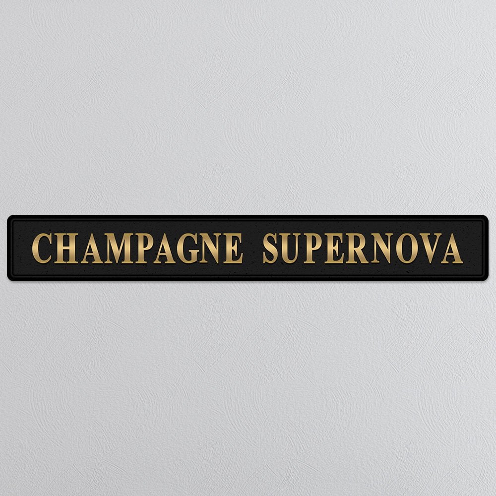 Black and gold foiled street sign with 'Champagne Supernova' wording.