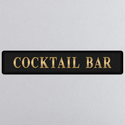 Black and gold foiled street sign with 'Cocktail bar' wording