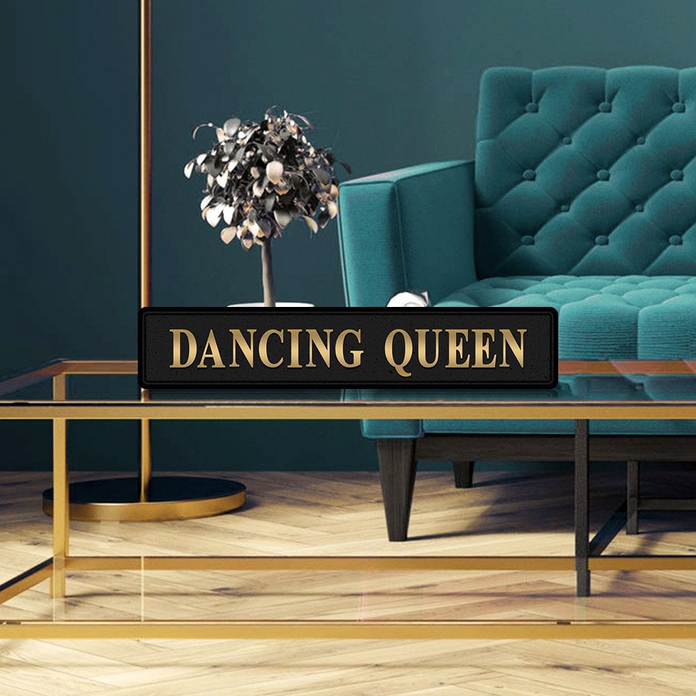 Black and gold foiled street sign with 'Dancing Queen' wording