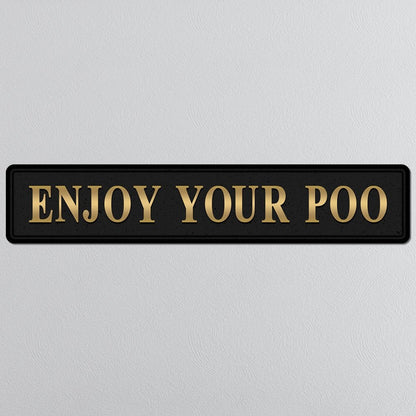 Black and gold foiled street sign with 'Enjoy Your Poo' wording
