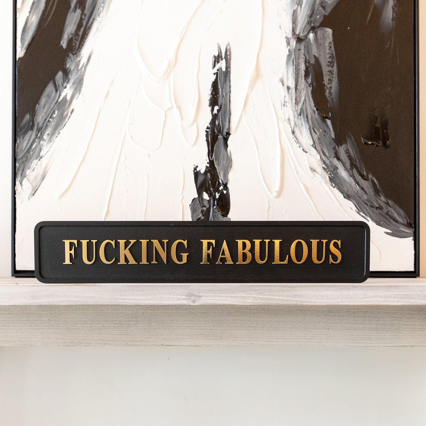 Black and gold foiled wooden street sign with 'Fucking Fabulous' wording