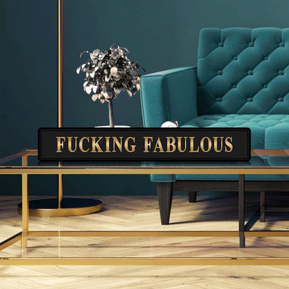 Black and gold foiled wooden street sign with 'Fucking Fabulous' wording