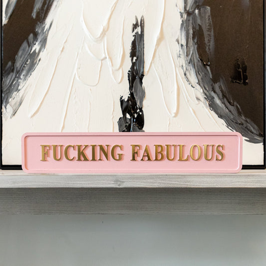 Pink and gold foiled street sign with 'Fucking Fabulous' wording