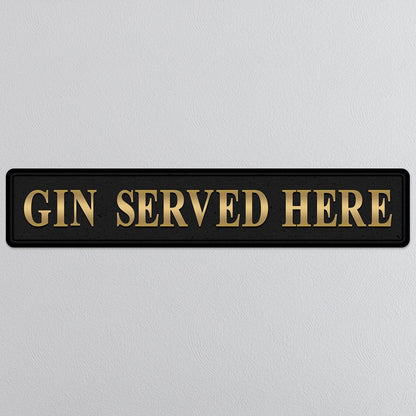 Black and gold foiled street sign with 'Gin served here' wording