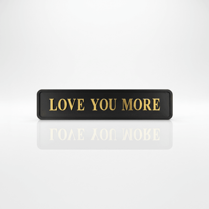 Black with gold foiled street sigh with "love you more" wording 