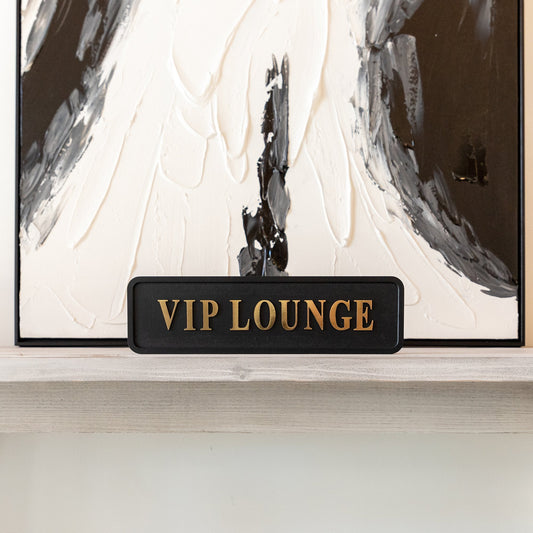 Black and gold foiled sign with 'VIP lounge' wording