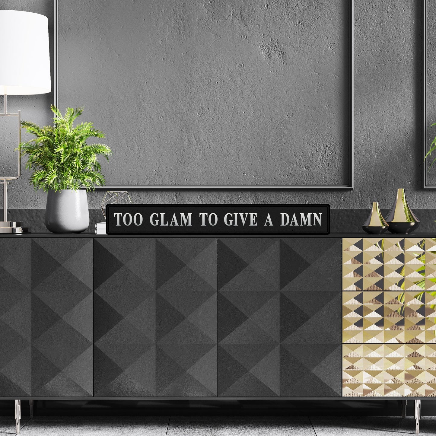 Black and silver foiled street sign with 'Too glam to give a damn' wording