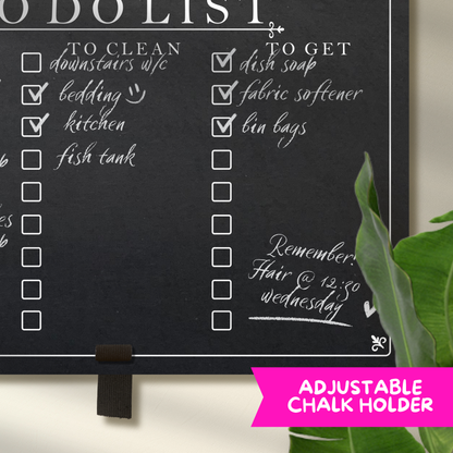 Close up of a chalkboard with adjustable pen holder at the bottom, featuring printed 'to clean' and 'to get' collumn headers with check boxes.