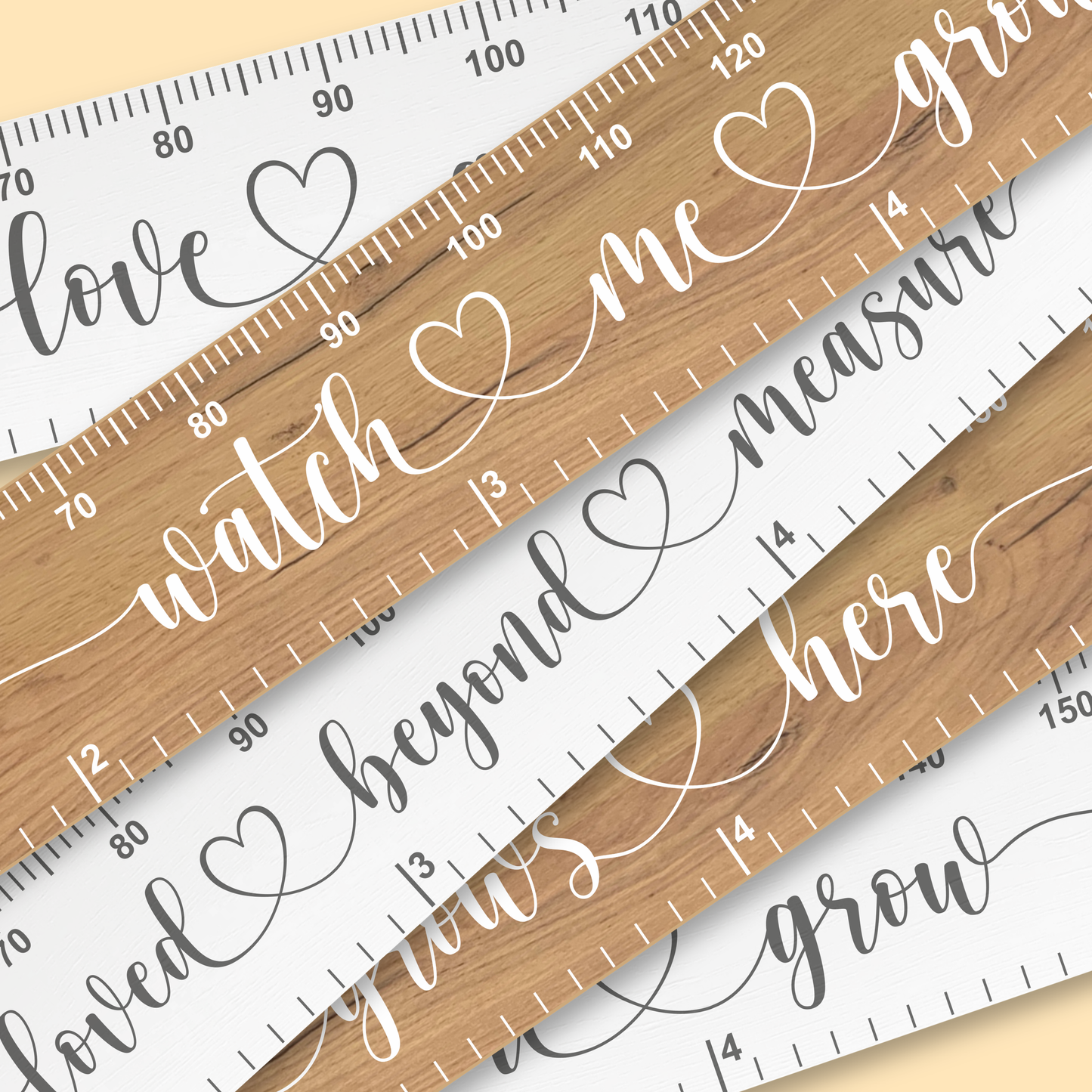 A group of wooden growth rulers in a mixture of white and natural wood with a variety of swirling, cursive messages printed up the middle