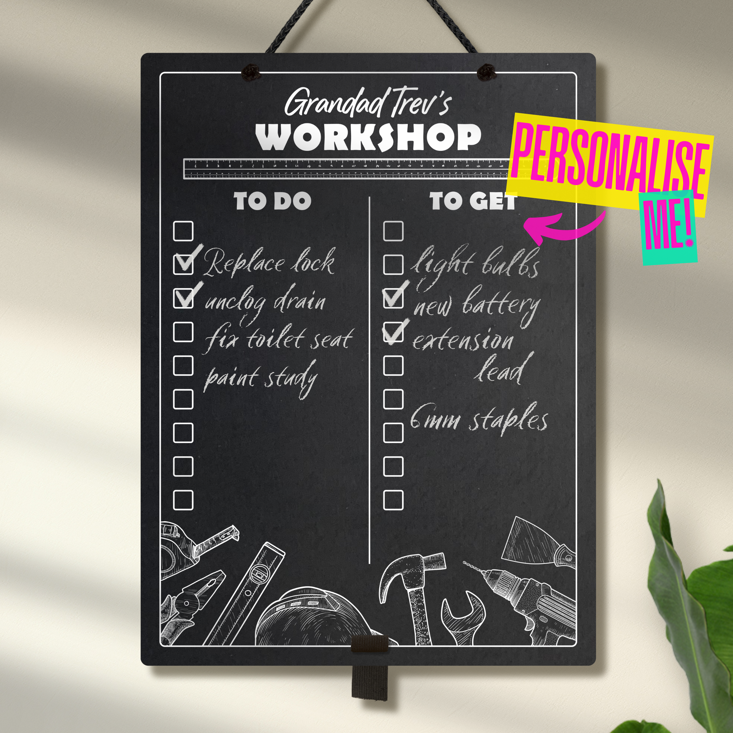 Large chalkboard hanging from a black rope with elastic pen holder at the bottom, featuring "to do" and "to get" collumn headers and check boxes printed with "Grandad Trev's Workshop" printed at the top. A colourful sign indicates "Personalise me!" with an arrow pointing towards the product.