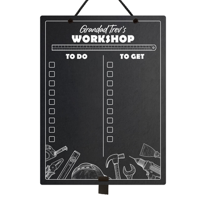 Large chalkboard hanging from a black rope with elastic pen holder at the bottom, featuring "to do" and "to get" collumn headers and check boxes printed with "Grandad Trev's Workshop" printed at the top. 